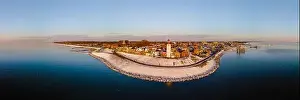 Water Tourism Prints: Drone view of the Lighthouse of Urk during winter with snow landscape in the Netherlands