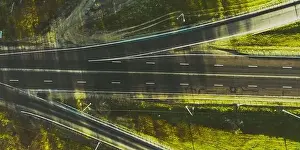Drone view of morning empty country side road with beautiful green landscape around