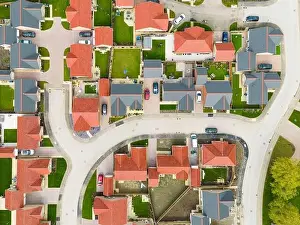 Aerial Cityscape Prints: Drone top down view of new bungalow housing development in rural England