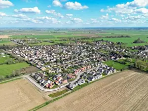 Homely Prints: Drone view of a new housing estate showing detached bungalows in a rural location in Cambridgeshire