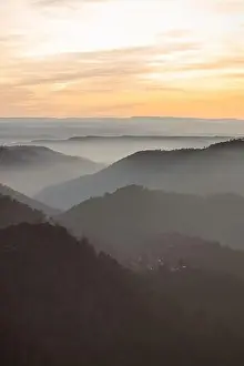 Nature Valley Prints: Drone view of picturesque scenery with bright sunset sky over foggy mountains and hills in Almatret
