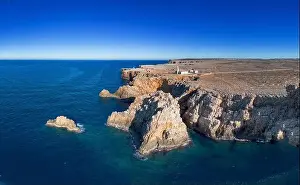 Balearic Island Prints: drone view of the Punta Nati lighthouse and coastal cliffs in northwestern Menorca