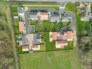 Top Down View Prints: Top down drone view of a small housing development at the edge of an East Anglian village