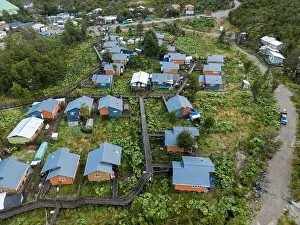 Drone view of Tortel with its small cabins - Discovering the beautiful village while traveling the Carretera Austral in