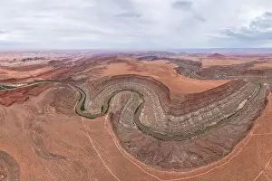 Winding River Prints: Drone view of twisting Rio San Juan as it carves through the layered red and orange strata of San Juan Canyon