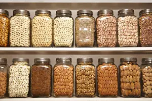 Dinodia Prints: Dry fruits cashew nut raisin pistachio almond walnut dried apricot kept in different glass jars on shelves in shop