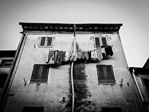 Drying Prints: Drying laundry at the facade of an oldresidential house in the Tuscany, Italy