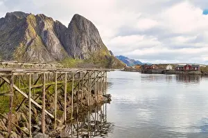 Log Cabin Prints: Drying racks for fish and traditional red rorbuer huts in the fishing village of Reine