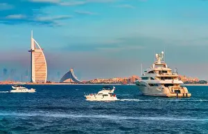 Jumeirah Beach Prints: Dubai city - amazing city center skyline and famous Jumeirah beach at sunset