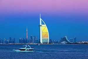 Jumeirah Beach Prints: Dubai city - amazing city center skyline and famous Jumeirah beach at sunset