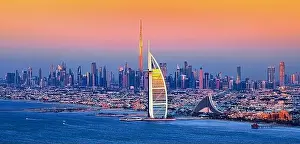 Dubai city - amazing city center skyline and famous Jumeirah beach at sunset, United Arab Emirates