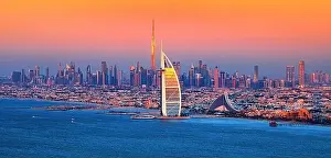 Dubai city - amazing city center skyline and famous Jumeirah beach at sunset, United Arab Emirates