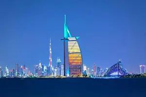 Jumeirah Beach Prints: Dubai city - amazing city center skyline and famous Jumeirah beach at sunset