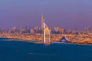 Dubai city - amazing city center skyline and famous Jumeirah beach at sunset, United Arab Emirates
