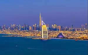 Dubai city - amazing city center skyline and famous Jumeirah beach at sunset, United Arab Emirates