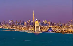 Dubai city - amazing city center skyline and famous Jumeirah beach at sunset, United Arab Emirates