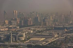 Images Dated 17th January 2017: DUBAI, UAE - APRIL 29: Aerial view of Downtown Dubai and skyscrapers during morning sandstorm