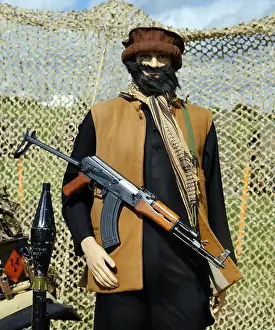 Throw Prints: Dummy of Afgan taliban fighter with AK47