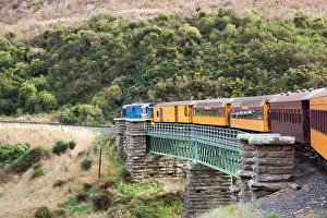 Exciting Prints: Dunedin, Otago, New Zealand. Morning service of the Taieri Gorge Railway crossing viaduct south of Hindon