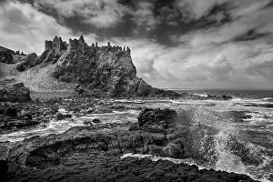 Grayscale Prints: Dunluce Castle in a dramatic clifftop setting on the Causeway Coast of County Antrim Northern Ireland