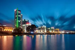 Belarus Prints: Dusk view of the Minsk skyline seen across the Svislach River (Raka Svislač) in Minsk