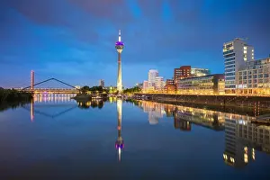 Dusseldorf, Germany. Cityscape image of Düsseldorf, Germany with the Media Harbour and reflection of the city in the Rhine river