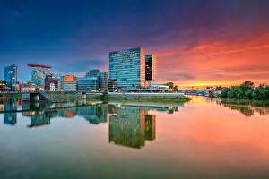Dusseldorf, Germany. Cityscape image of Düsseldorf with the Media Harbour and reflection of the city in the Rhine river, during twilight