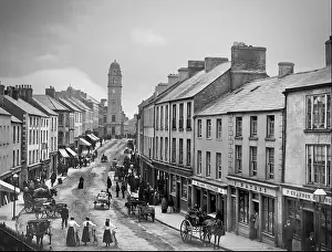 Eire Prints: An early 20th-century photograph of shops and shoppers in Church street in Enniskillen