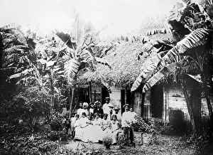 An early twentieth century black and white photograph showing a native family in Panama with their hut