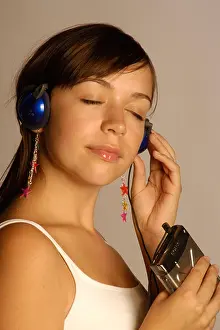 Eyes Closed Prints: earphones headphones entertainment electronics eyes closed girls hear long hair music hearing Player portra