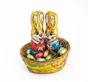 Baskets Prints: Two Easter bunnies in a basket with chocolate eggs
