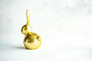 Easter holiday card concept with golden bunny