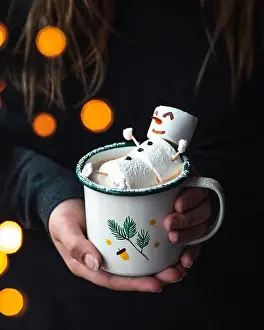 Cocoa Prints: Edible marshmallow snowman laying on top of the hot cocoa in a winter themed mug
