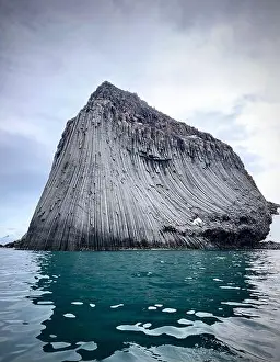 Dramatic Landscape Prints: Edinburgh Rock, Antarctica: a towering geological wonder rising from icy waters