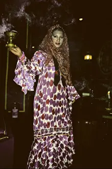 Headwear Prints: Egyptian woman in formal dress carrying an incense burner, Egypt
