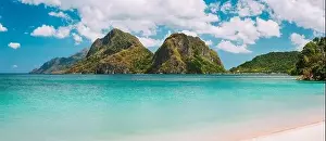 Hopping Prints: El Nido, Corong Corong beach with massive limestone mountain ridge top with blue lagoon in front