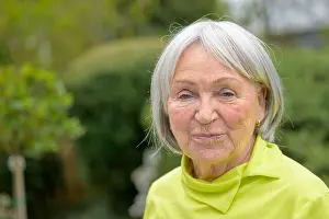 Looking To Camera Prints: Elderly lady in her early 80s, with white-grey hair and a green shirt