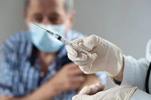 Vaccine Prints: elderly man getting coronavirus vaccine