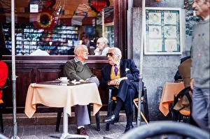 Canarian Prints: Elderly men sitting talking over coffee at the Atlantico cafe