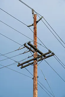 Engineering Equipment Prints: Electric pole and wires, wood electricty pole on blue sky background