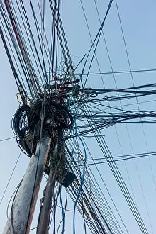 Switch Prints: Electricity poles with overcrowded wires and distribution boxes in India