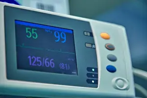 Nurse Prints: Electrocardiogram in hospital surgery operating emergency room showing patient heart rate