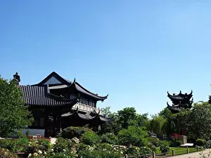 A very elegant intricate built pagoda in a lush garden