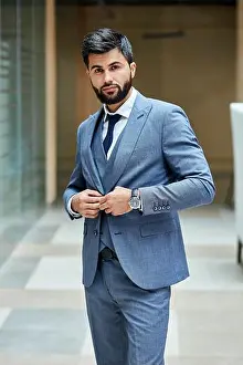 Watches Prints: Elegant male in suit posing in street. Attractive brunette in grey suit, black haired