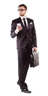 Briefcase Prints: Elegant man in suit with mobile phone and briefcase isolated on white