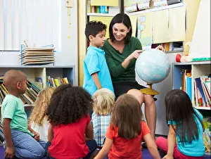 Pupils Prints: Elementary Pupils In Geography Class With Teacher