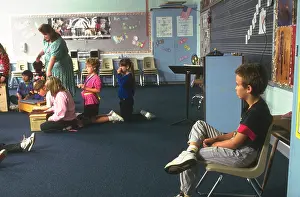 Pupils Prints: Elementary student being punished by sitting in corner model released