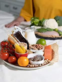 Symptoms Prints: Elimination diet concept. A woman avoids food allergens - fish