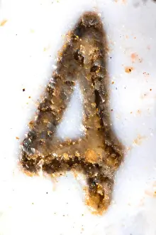 Magnification Prints: Embedded digit 4 on sim card under the microscope. Closeup macro photography