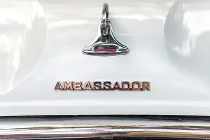 Kochi Prints: Emblem on a white Ambassador, Fort Cochin, Kochi, Kerala, India